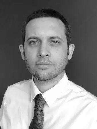 black and white photo of sam borret , the leading marketing consultant at legmark.com